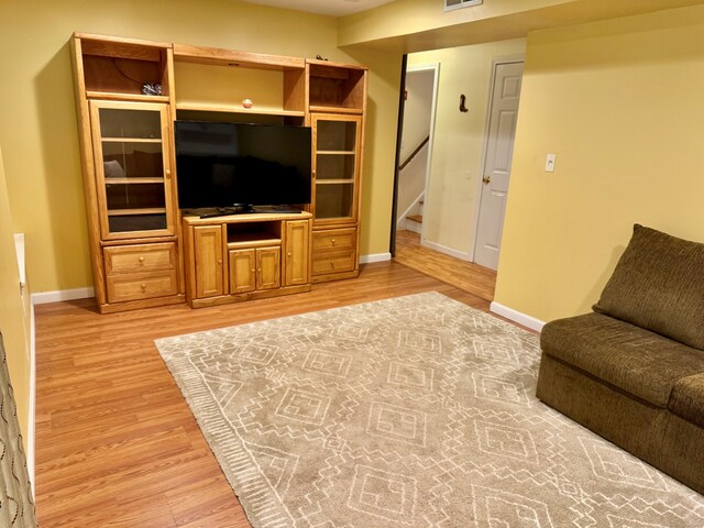 168 Cooper Ln, Hamden, CT 06514 - living room with light wood-style floors and stairway