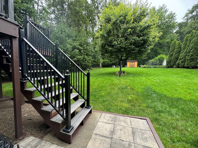 168 Cooper Ln, Hamden, CT 06514 - view of grassy yard with stairs and a storage shed