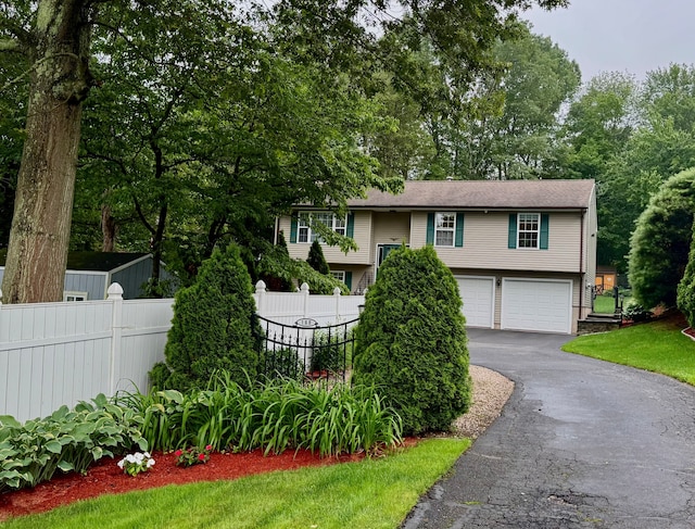 168 Cooper Ln, Hamden, CT 06514 - bi-level home with driveway and a garage
