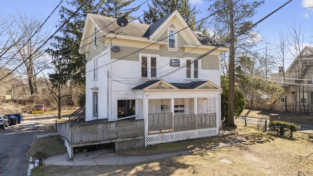 122 Derby Ave, New Haven, CT 06511 - view of front of home with a porch, driveway, and roof with shingles