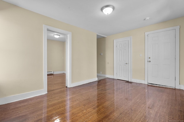 122 Derby Ave, New Haven, CT 06511 - spare room with wood finished floors, baseboard heating, and a smoke detector