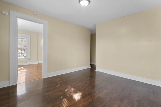 122 Derby Ave, New Haven, CT 06511 - empty room with wood finished floors and a smoke detector