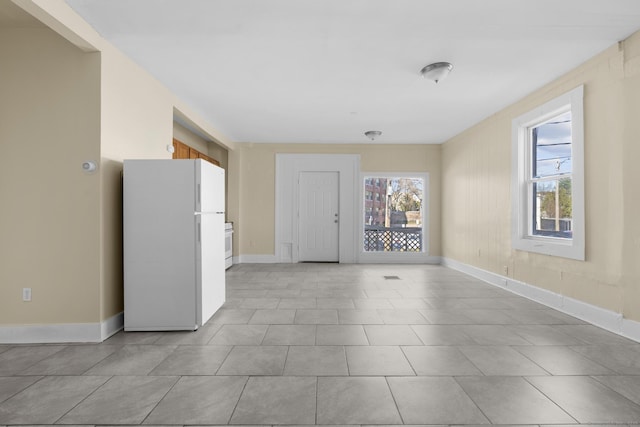 122 Derby Ave, New Haven, CT 06511 - unfurnished living room with light tile patterned floors
