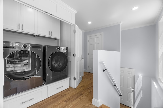 26 Meadowood Ln, Old Saybrook, CT 06475 - laundry room featuring washer and dryer, crown molding, light wood-type flooring, recessed lighting, and cabinet space