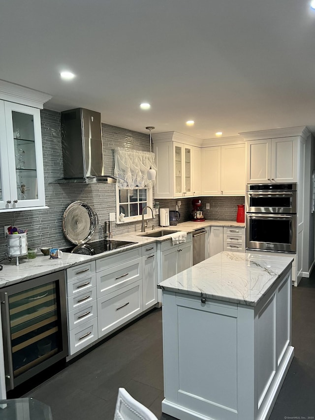 40 Great Plain Rd, Danbury, CT 06811 - kitchen with wall chimney exhaust hood, wine cooler, appliances with stainless steel finishes, decorative backsplash, and white cabinets