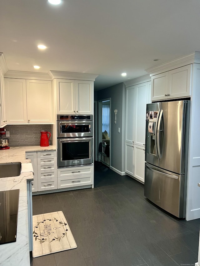 40 Great Plain Rd, Danbury, CT 06811 - kitchen featuring appliances with stainless steel finishes, white cabinets, light stone counters, and recessed lighting