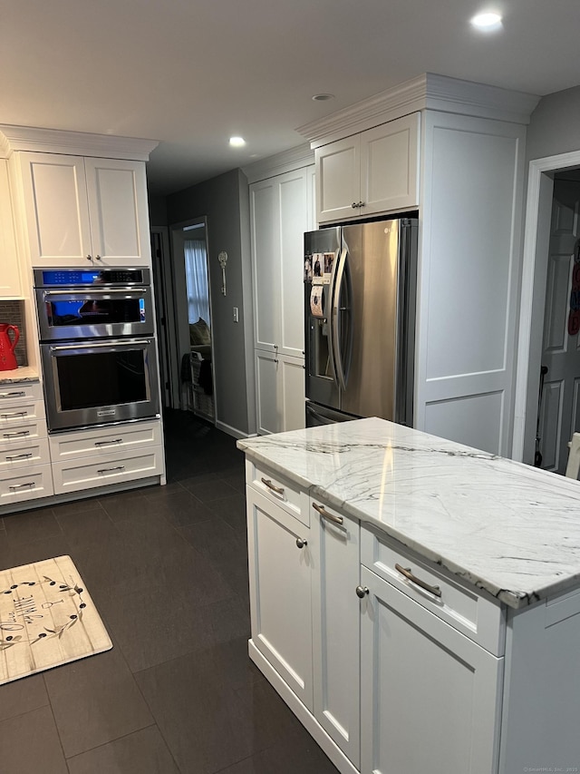 40 Great Plain Rd, Danbury, CT 06811 - kitchen with appliances with stainless steel finishes, white cabinets, recessed lighting, light stone counters, and dark tile patterned floors