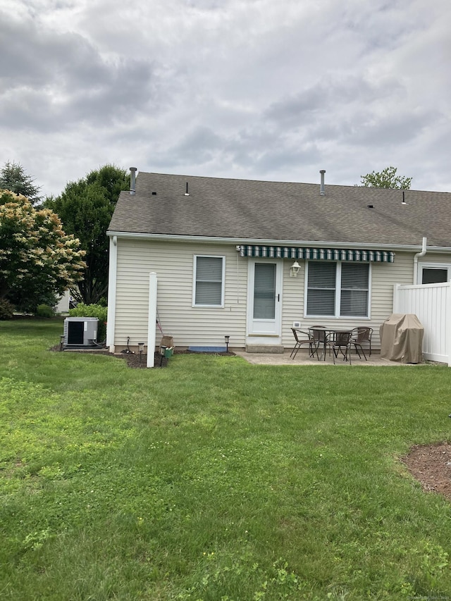 611 Overlook Path Unit 611, Southington, CT 06489 - back of property featuring a patio area, a yard, and a shingled roof