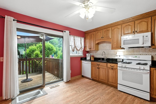 222 Sunrise Hill Rd Unit 222, Norwalk, CT 06851 - kitchen featuring white appliances, light wood-style floors, a ceiling fan, and brown cabinetry