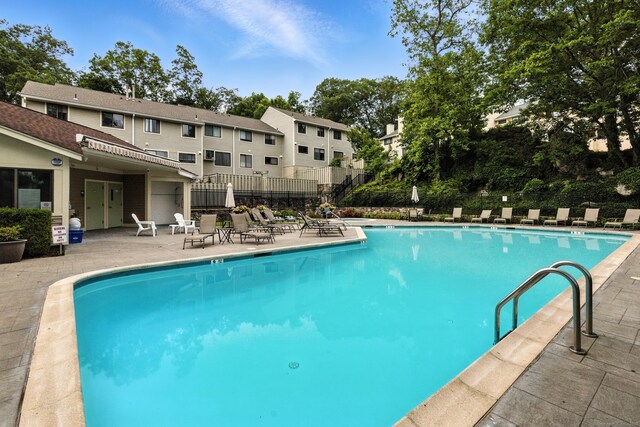 222 Sunrise Hill Rd Unit 222, Norwalk, CT 06851 - community pool featuring a patio area and a residential view