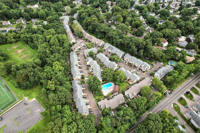 222 Sunrise Hill Rd Unit 222, Norwalk, CT 06851 - aerial view of property and surrounding area featuring a pool and a tree filled landscape