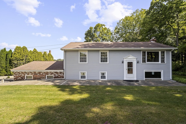 538 Quaddick Rd, Thompson, CT 06277 - view of front of property with a front lawn, a chimney, and a patio