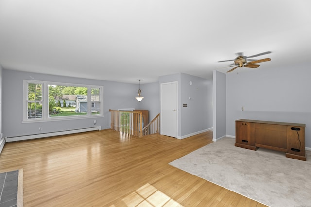538 Quaddick Rd, Thompson, CT 06277 - unfurnished living room with a baseboard radiator, light wood finished floors, and a ceiling fan