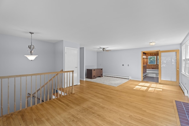 538 Quaddick Rd, Thompson, CT 06277 - spare room featuring baseboard heating, light wood-style flooring, and a ceiling fan