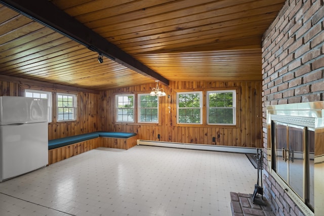 538 Quaddick Rd, Thompson, CT 06277 - unfurnished living room featuring wood ceiling, baseboard heating, a chandelier, and wooden walls