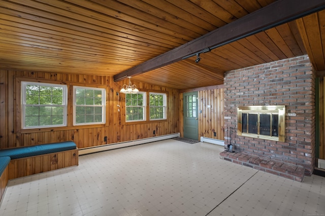 538 Quaddick Rd, Thompson, CT 06277 - unfurnished living room featuring a baseboard radiator, plenty of natural light, a chandelier, wood ceiling, and wood walls