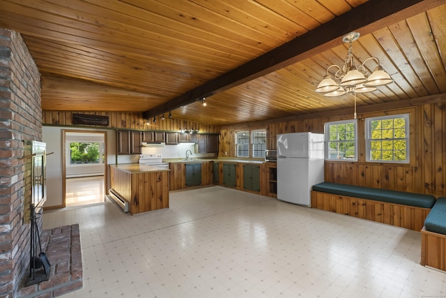 538 Quaddick Rd, Thompson, CT 06277 - kitchen with white appliances, wood ceiling, wooden walls, a chandelier, and healthy amount of natural light