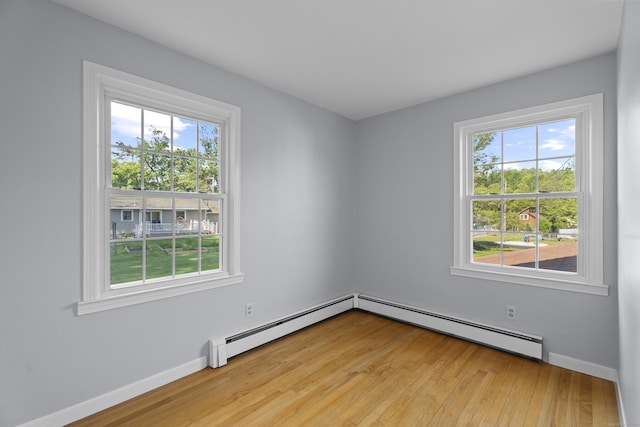 538 Quaddick Rd, Thompson, CT 06277 - unfurnished room featuring baseboard heating, plenty of natural light, and light wood finished floors