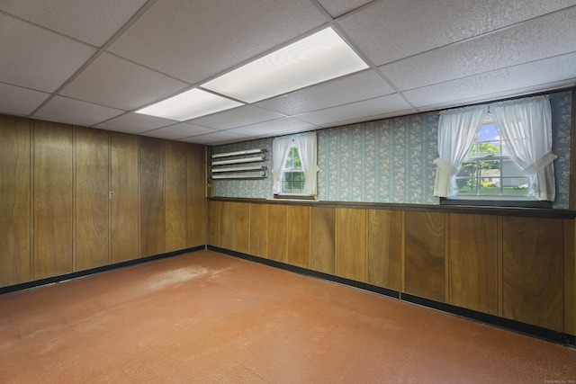 538 Quaddick Rd, Thompson, CT 06277 - spare room featuring healthy amount of natural light, a drop ceiling, wooden walls, and light floors