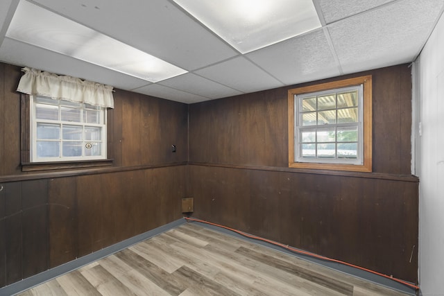 538 Quaddick Rd, Thompson, CT 06277 - below grade area featuring light wood-style flooring and wooden walls