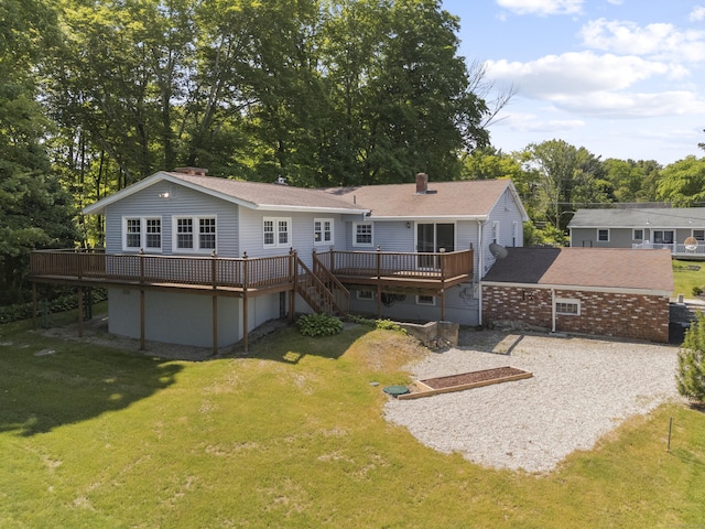 538 Quaddick Rd, Thompson, CT 06277 - rear view of house featuring a deck, driveway, a yard, a chimney, and stairway