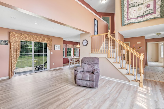 56 Stagecoach Cir, Milford, CT 06460 - stairs with wood finished floors and a high ceiling