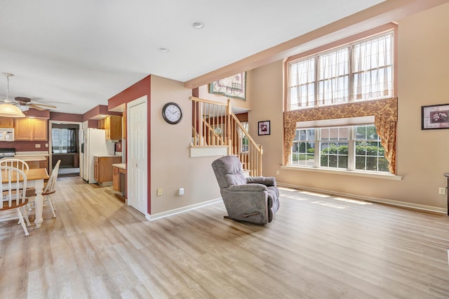 56 Stagecoach Cir, Milford, CT 06460 - sitting room with light wood-style flooring, stairs, a ceiling fan, and recessed lighting