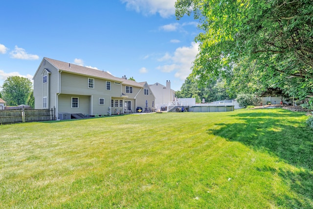 56 Stagecoach Cir, Milford, CT 06460 - rear view of house with a fenced backyard
