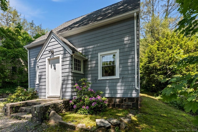 141 Cannon St, Hamden, CT 06518 - view of side of property with a shingled roof