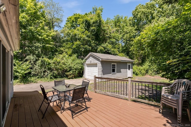 141 Cannon St, Hamden, CT 06518 - wooden deck with an outdoor structure, outdoor dining space, and a detached garage