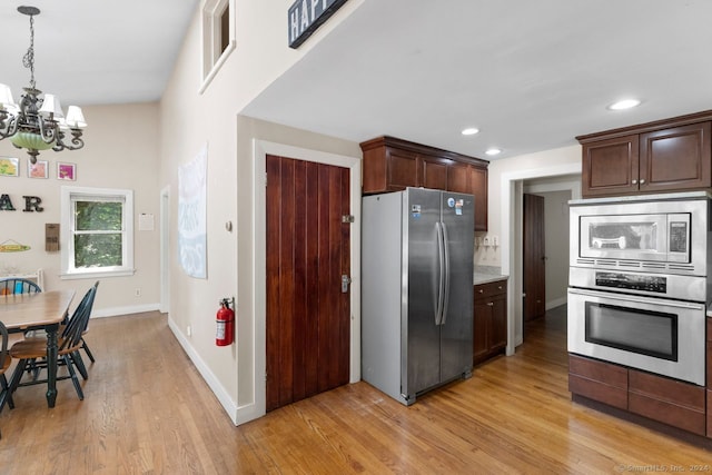 141 Cannon St, Hamden, CT 06518 - kitchen with appliances with stainless steel finishes, a chandelier, light wood-style floors, and recessed lighting