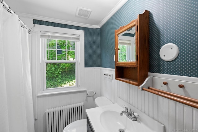 141 Cannon St, Hamden, CT 06518 - bathroom featuring radiator, wainscoting, crown molding, wallpapered walls, and plenty of natural light