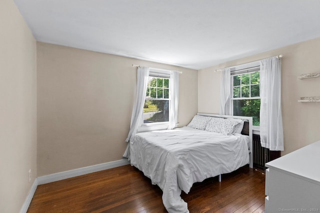 141 Cannon St, Hamden, CT 06518 - bedroom with dark wood-style floors and radiator