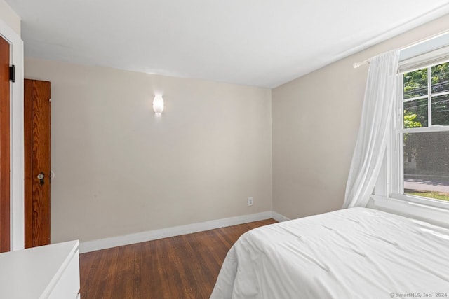 141 Cannon St, Hamden, CT 06518 - bedroom with dark wood-style floors and baseboards