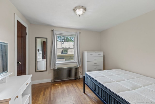 141 Cannon St, Hamden, CT 06518 - bedroom with radiator and wood-type flooring