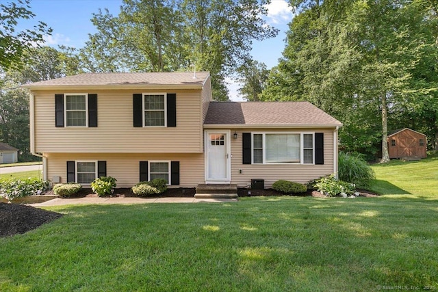 2 Sunwoods Cir, Hamden, CT 06518 - split level home featuring a front yard and a storage unit