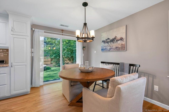 2 Sunwoods Cir, Hamden, CT 06518 - dining room with a chandelier and light wood finished floors