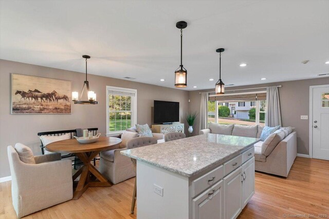 2 Sunwoods Cir, Hamden, CT 06518 - kitchen featuring open floor plan, plenty of natural light, light wood-style flooring, a center island, and recessed lighting