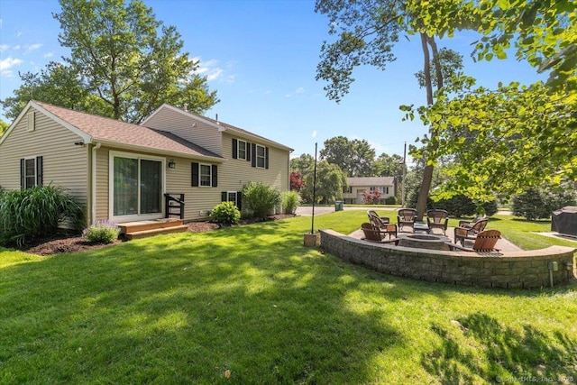 2 Sunwoods Cir, Hamden, CT 06518 - view of grassy yard with a fire pit and a patio area