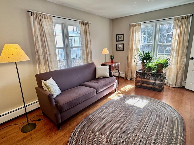 111 Spring Garden St, Hamden, CT 06517 - living room featuring a baseboard radiator and wood finished floors