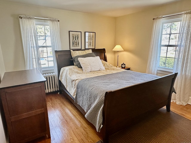 111 Spring Garden St, Hamden, CT 06517 - bedroom featuring radiator heating unit and wood finished floors