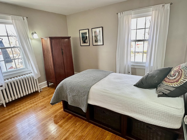 111 Spring Garden St, Hamden, CT 06517 - bedroom featuring radiator heating unit and light wood-style floors
