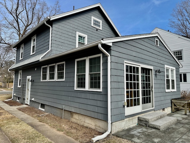 111 Spring Garden St, Hamden, CT 06517 - view of side of property with a patio