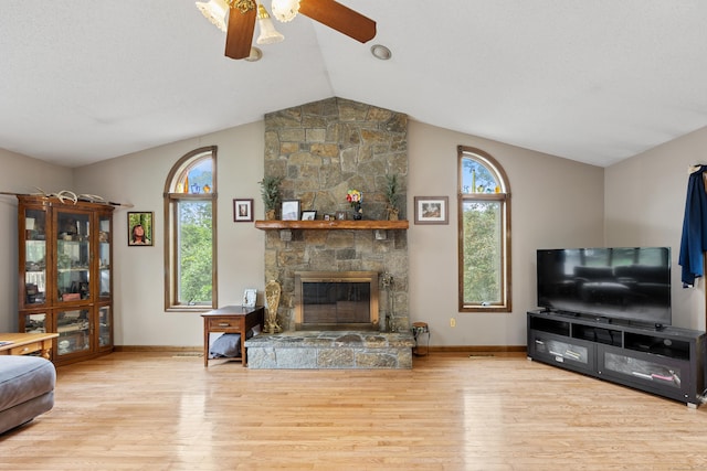 291 Guinevere Rdg, Cheshire, CT 06410 - living room featuring vaulted ceiling, wood finished floors, a ceiling fan, and a stone fireplace