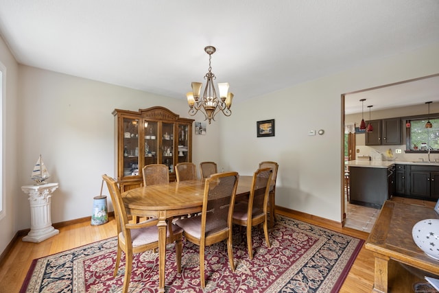 291 Guinevere Rdg, Cheshire, CT 06410 - dining space featuring a chandelier and light wood-style flooring