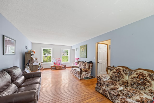 291 Guinevere Rdg, Cheshire, CT 06410 - living room with wood finished floors and a textured ceiling