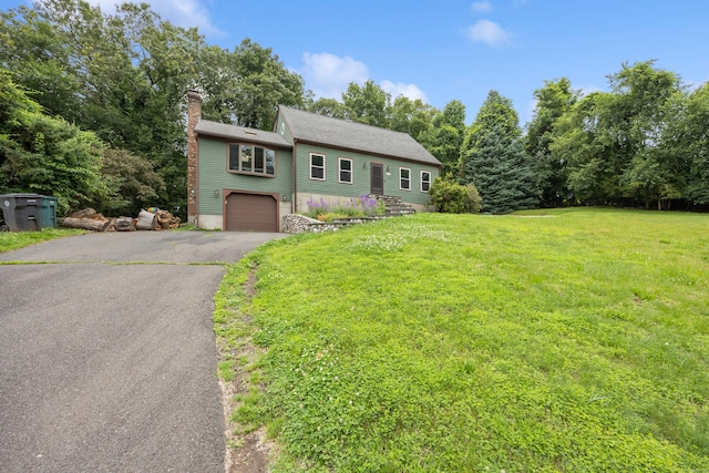291 Guinevere Rdg, Cheshire, CT 06410 - view of front of home featuring a garage, asphalt driveway, a chimney, and a front lawn