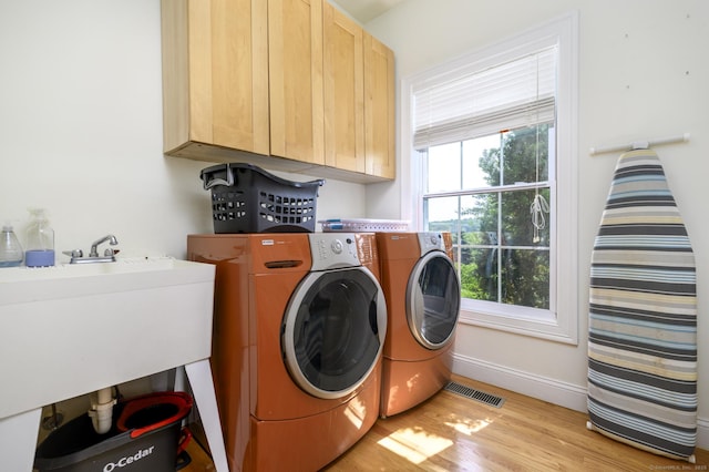 7 Castlewood Dr Unit 7, Monroe, CT 06468 - laundry area featuring cabinet space, washing machine and dryer, and light wood finished floors