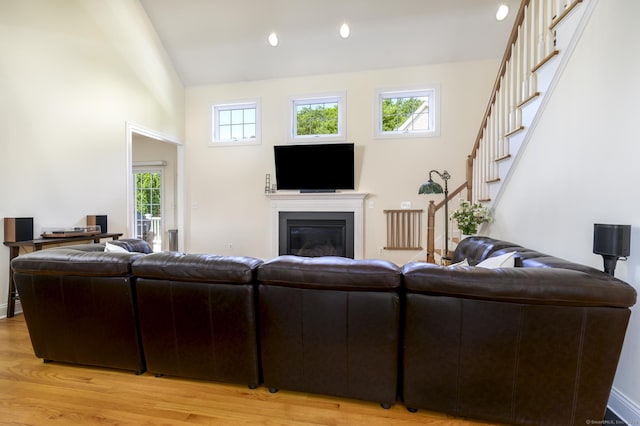 7 Castlewood Dr Unit 7, Monroe, CT 06468 - living room with stairway, plenty of natural light, light wood-style flooring, vaulted ceiling, and recessed lighting