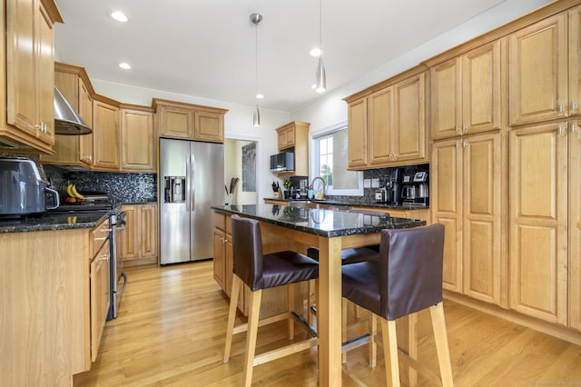7 Castlewood Dr Unit 7, Monroe, CT 06468 - kitchen with stainless steel appliances, decorative backsplash, light wood-style flooring, a kitchen island, and recessed lighting